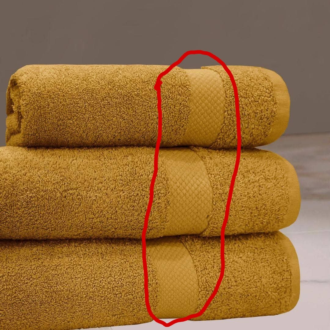 Those flat bands on fancy golden bath towels aren't just for ...