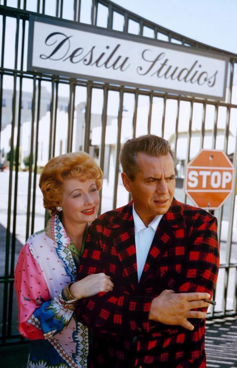 Desi Arnez and LUCILLE BALL — who left us 37yrs ago today, aged 77 —  by the gates to their studio in 1959.