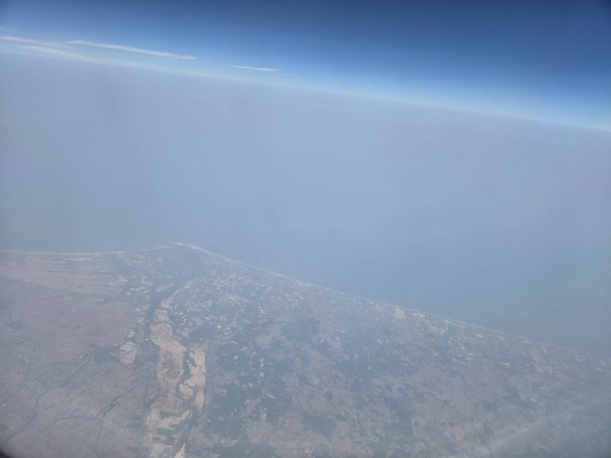 Ananth_IRAS's tweet image. A view from the aircraft just as we started the descent towards Chennai, flying along the coast around Nellore. The photo appears to show the confluence of the almost-dry Pennar River and the sea near Nellore. #flight #View