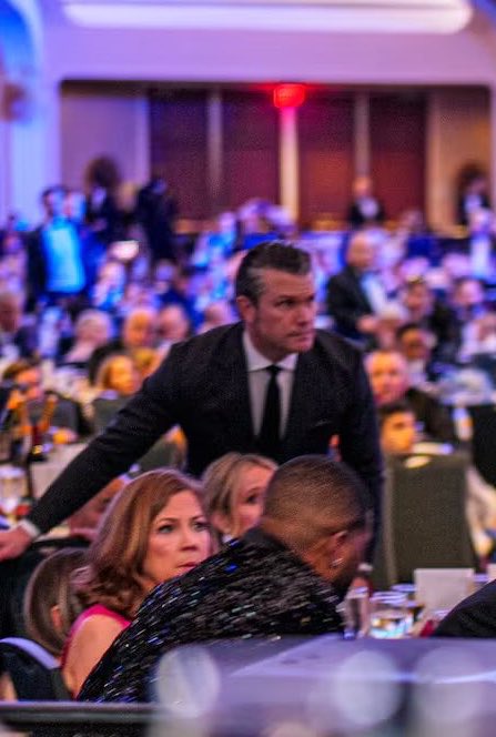 During the chaos, while everyone was shivering and hiding,

The US Secretary of War, Peter Hegseth stood gallantly, formed a shield over his wife, while also scanning for the intruder.

Donald Trump did a good job in picking his men. Tough guys all through.