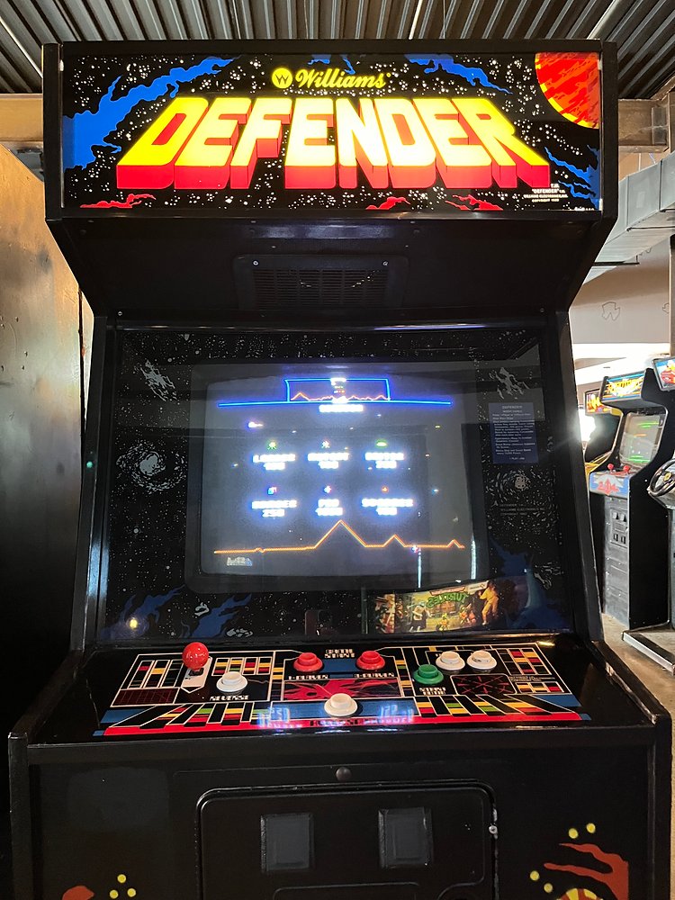 AC_DC_Twivia's tweet image. #ACDC Trivia Question #5,890: Brian Johnson is seen here playing the arcade video game Defender which came out in 1981. Two years later Brian included a lyric, "no space Defender" into which AC/DC song? @acdc @BrianJohnson #Defender #Videogame #Arcade