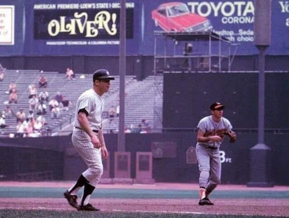 Jimfrombaseball's tweet photo. "I signed with Baltimore as a second baseman at age 18 and they gave me a $4,000 bonus at the time.
I wasn’t one of those “Bonus Babies” that got $30,000, that’s for sure.
I had a great glove, but I still had a lot left to learn, but the Orioles believed in me, so that gave me some confidence.
I played at York, Pennsylvania, Class B, and I hit around .330, so I was very happy with that.
Being from Little Rock, Arkansas, I had never played with black players before being in the minors.
Some people asked me back then:
“Do I have any black friends,” and I had to say no.
In Arkansas, they segregated the schools back then.
But, to be honest—I never really thought about it when I played with black players in the minors or with the Orioles.
We all played together just fine without any issues—it was easy.
We had some great instructors with the Orioles and they worked with me all the time to become a better fielder.
My goal was to be aggressive and not wait for the ball.
I was always working to get a jump on the ball by anticipating where it was headed.
I was blessed with decent hand-eye coordination, and seemed to have a sense where the ball was going to be hit, which was helpful.
I never altered my fielding style, which was moving around—I never wanted to be stationary, that’s for sure.
I learned a ton from George Kell.
I admired him when I was a youngster, so playing with him for the Orioles in 1956 was a big deal and a great opportunity for me to learn from one of the best."
Brooks Robinson.
Saturday, August 3, 1968.
The bottom of the 3rd.
Mickey Mantle and Brooks Robinson.
Yankee Stadium.