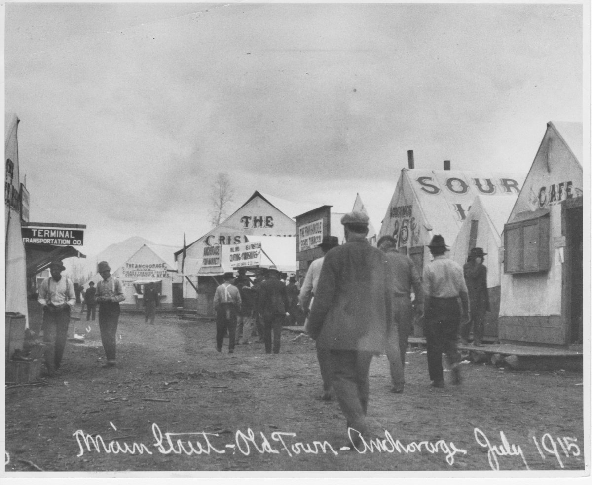 ANC_Historian's tweet image. July 1915, main street in the Anchorage tent city. The downtown townsite auctions began July 10. Whoever wrote the inscription was being funny with the "old town" part. My article posting later today is more rare 1915 views of Anchorage with the context. #alaskahistory #alaska