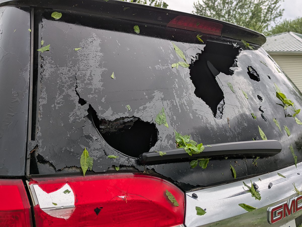 Hail shattered the rear window of this car in Walker, Missouri, a ...