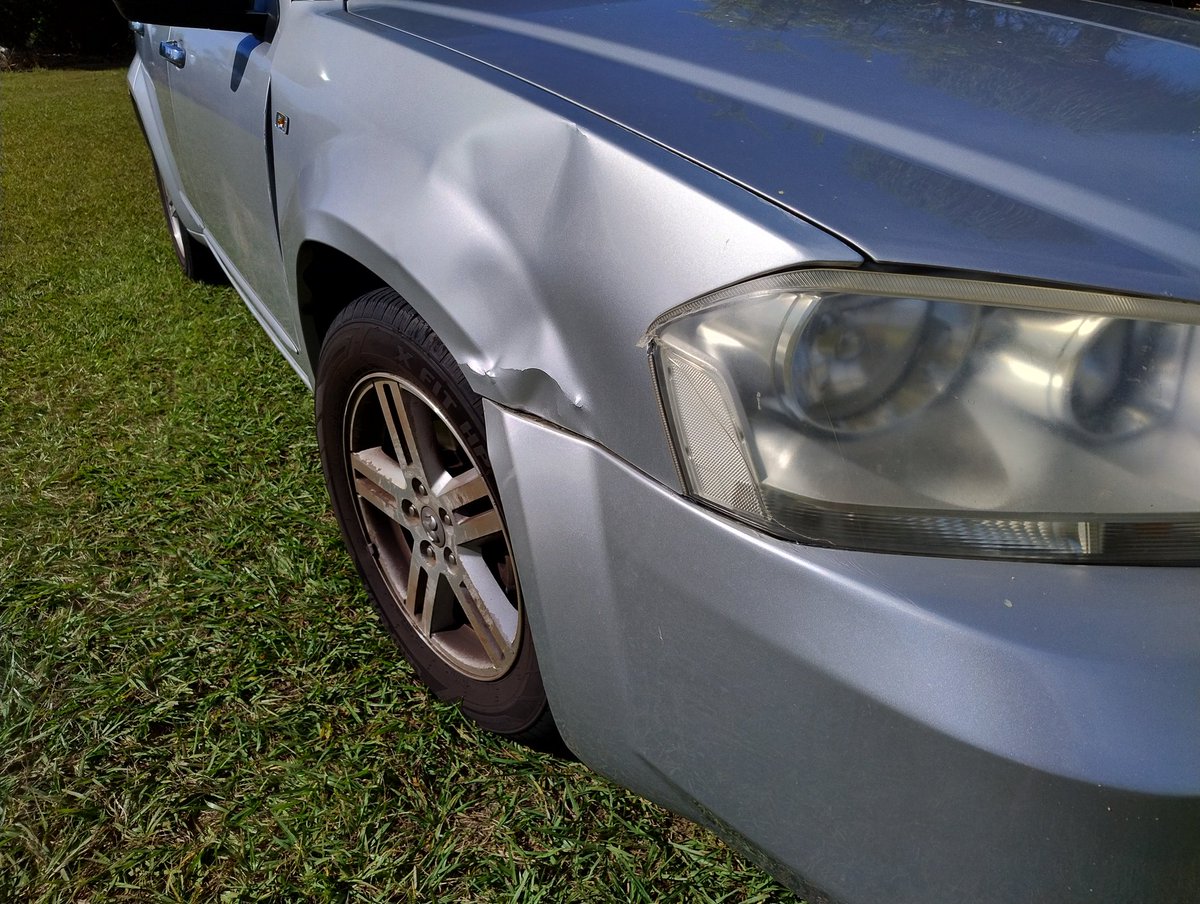 Classic_Clunker's tweet image. My 2007 #Dodge #Avenger has been hit by a mob - of kangaroos. It happened while driving through a parkland area at 5am. Thankfully I wasn't driving fast. You can see the dent from one in the door. Waiting on word from the insurance company on whether it's repaired or a write-off
