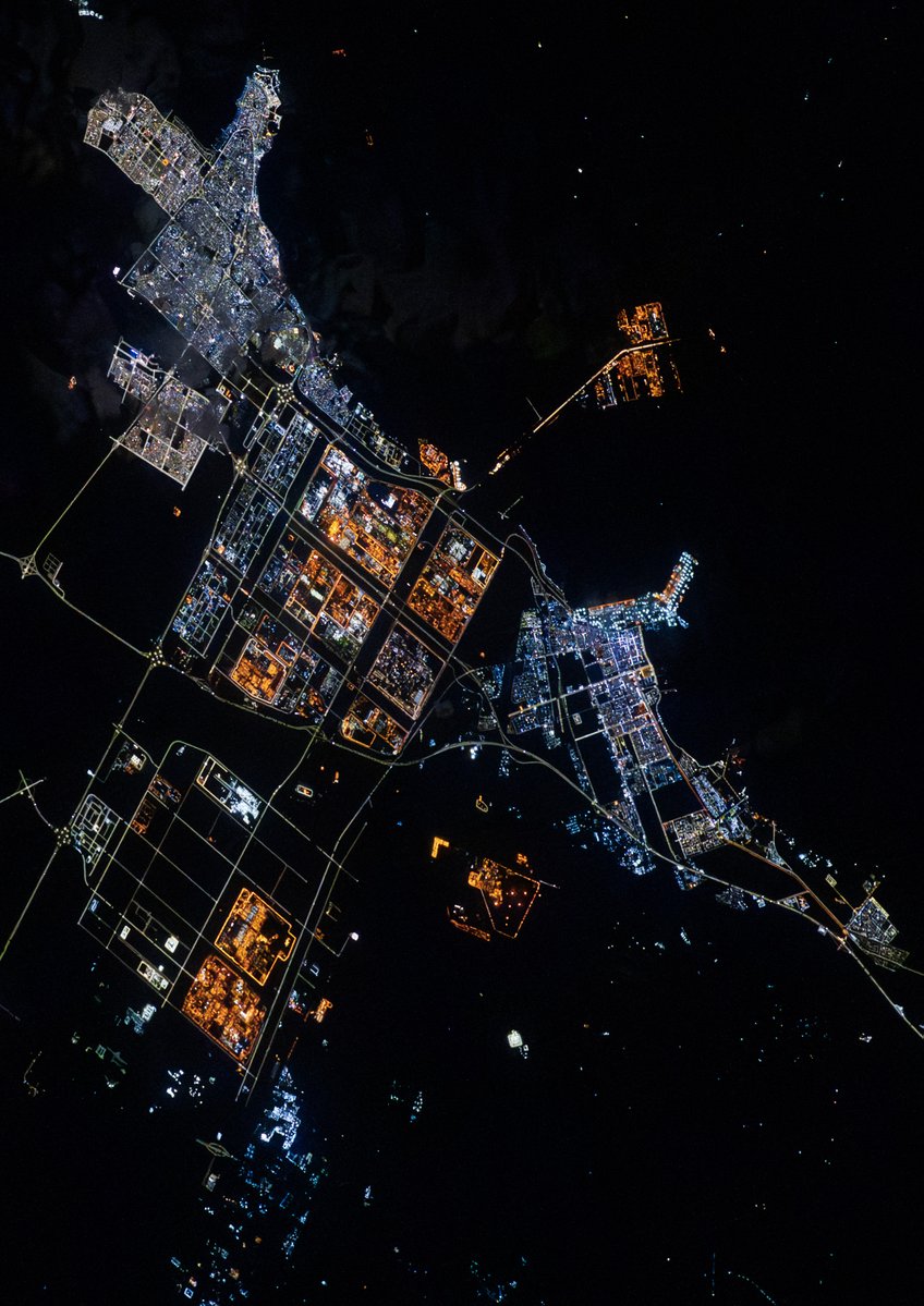 Al Jubail, Saudi Arabia as seen on ISS Expedition 72. Home to some of the world's largest petrochemical industry, the bright city lights starkly contrast the dark of the surrounding desert and waters.