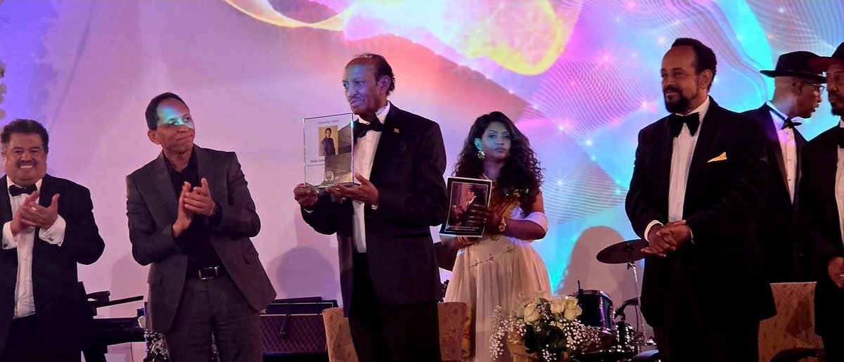 SheabiaForever's tweet image. Honoring a giant of Eritrean music, Haile Gebru. 🇪🇷🏆 The energy at the Cultural Civic Center was electric as we celebrated his Lifetime Achievement Award. A beautiful night of culture, respect, and legendary music.

​Give him his flowers while he can smell them. 💐✨

​#Eritrea