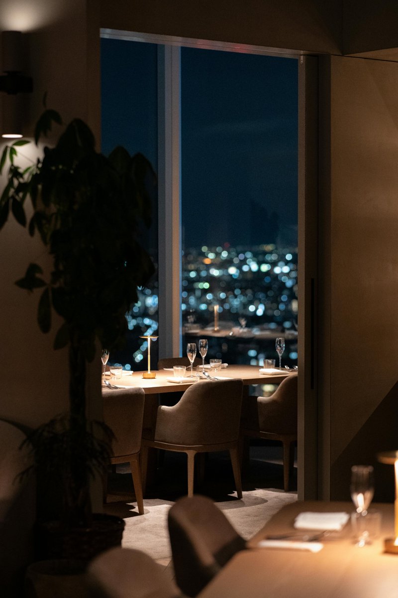 Catherine9T's tweet photo. A quiet table, city lights, and a mind that finally gets to slow down. https://t.co/3CggfvfTHI