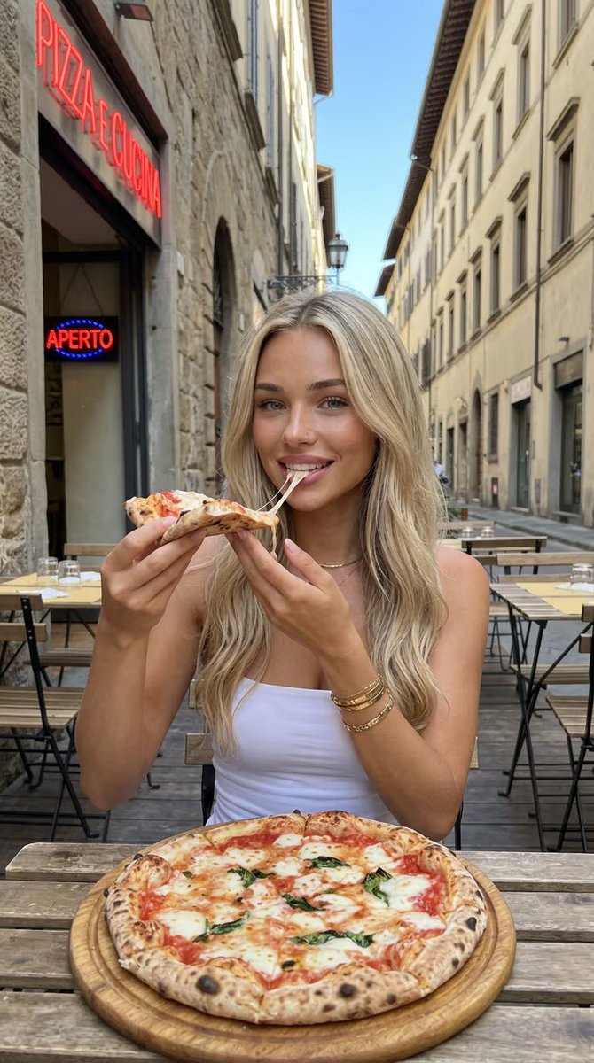 johnprofitsai's tweet photo. AI content → US-based devices (@hyperattn) → massive reach → real users

Everyone focuses on content. Winners focus on distribution.

Follow + bookmark for more 👇

{
  "prompt": "attractive blonde woman sitting at an outdoor Italian restaurant on a narrow European street, eating a slice of margherita pizza with melted cheese stretch, smiling at camera, long wavy hair, minimal gold jewelry, white top, rustic stone buildings, wooden tables, soft natural daylight, cinematic depth of field, lifestyle travel aesthetic, highly detailed, photorealistic, 8k",
  "aspect_ratio": "9:16"
}