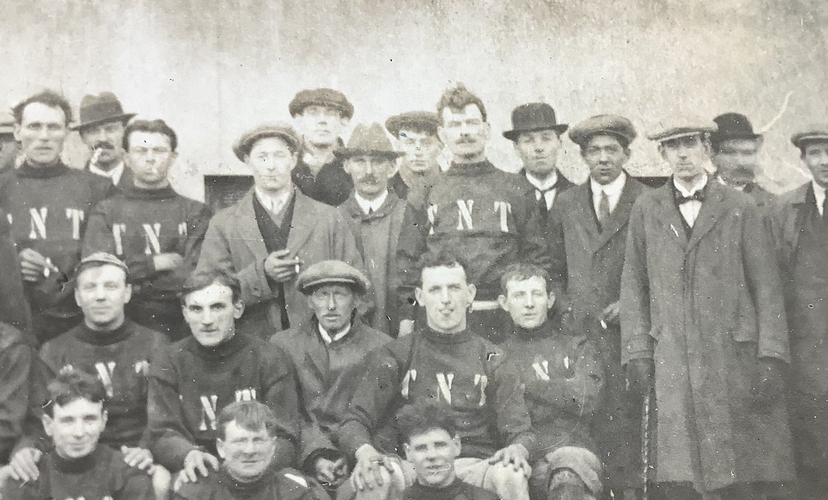 PaulSuttonKing's tweet image. The #postcard week starts with a bang. Today’s Monday mystery appears to be football related. We used plenty of TNT during WW1 but is this in any way related. Most of the factories were staffed by women. Chap on the left has a distinctive badge on his jacket. Any ideas?