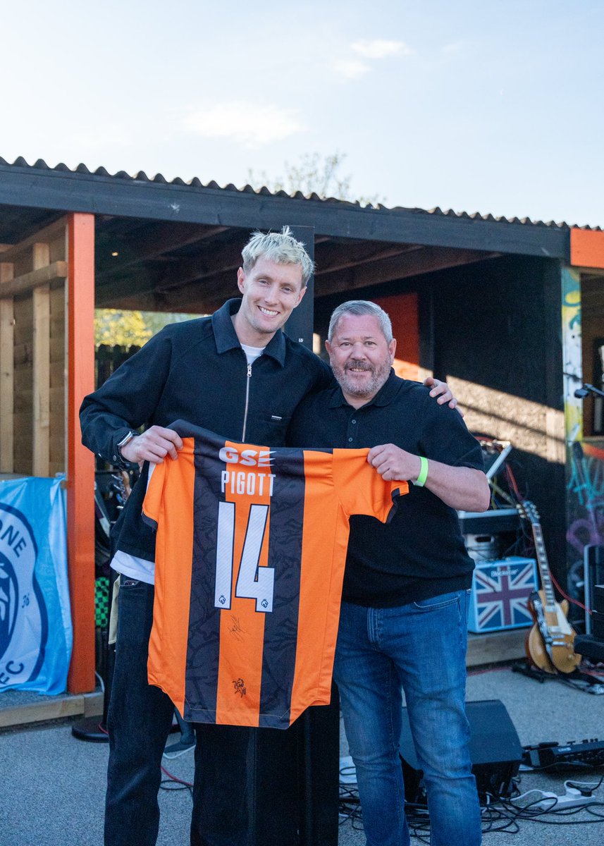 FIFC's tweet photo. 🍾 A big thank you and shoutout to Motis for sponsoring our final game of the 2025/26 season against Cheshunt at the Alcaline Stadium on Saturday.

They selected Jake Hutchinson as Player of the Match and presented his award at full time. Jake ended the season with a hat-trick and as the @IsthmianLeague Premier Division’s top goalscorer 🎩🏆

A big thank you also to Motis for sponsoring Joe Pigott this season and Motis Estates for sponsoring Josh Strouts 🤝

#fifc | 🟠⚫️