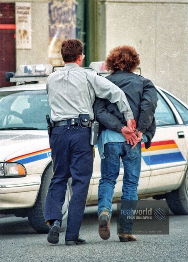 RealWorldImage's tweet image. The RCMP get their man after a stabbing in Kelowna, BC, Canada in the nineties. Gary Moore photo. Real World Photographs. #crime #Kelowna #Canada #Grok #photojournalism #police #RCMP #suspect #arrest #cops #travelphotography #garymoore #garymoorephotography  #streetphotography