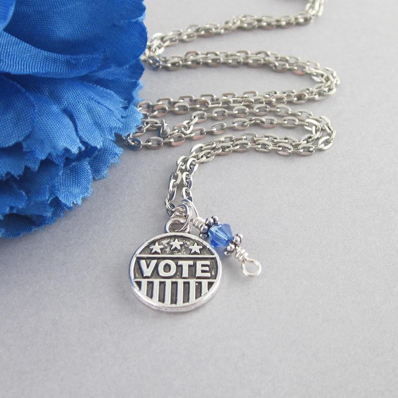adorebynat's tweet image. Silver "VOTE" charm necklace with blue crystal — chic election jewelry for Democrats. Wear it to show your support this season. ✨ etsy.com/listing/448092…  #bmecountdown #mothersday #ShopSmall
