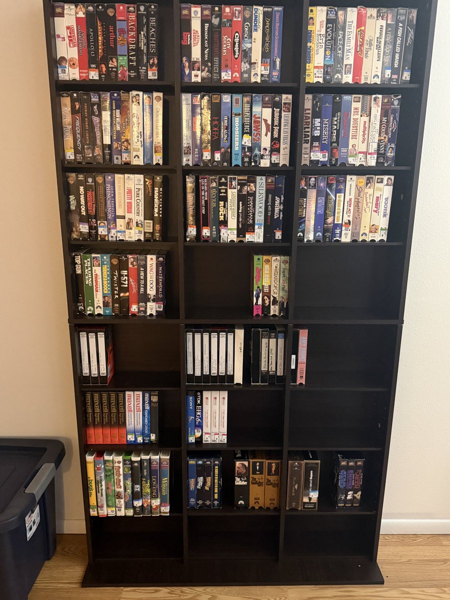 TheChuckRowe's tweet photo. Media shelf #1 is assembled and loaded with #VHS tapes. Shelf #2 is on the way here. Gotta get those DVDs out of the storage tote. #physicalmedia #dvd https://t.co/mcWGAV7lSS