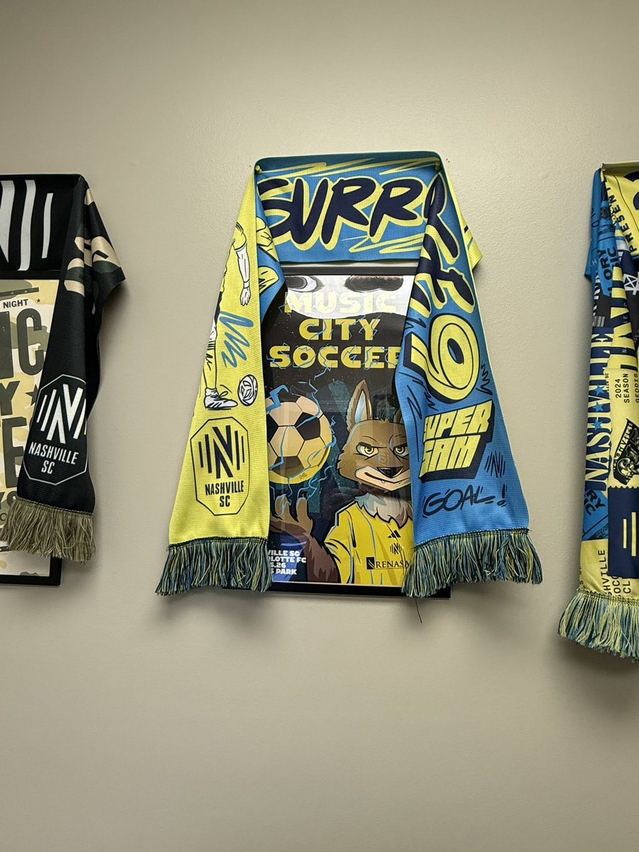 BittburgerSr's tweet photo. Fitting pair for my wall after the win Saturday!! 💛💙🫡 #COYBIG #EveryoneN #SuperSam @FUBAR_SG @TheBacklineSC @NashvilleSC https://t.co/dyhYCD1nQ3