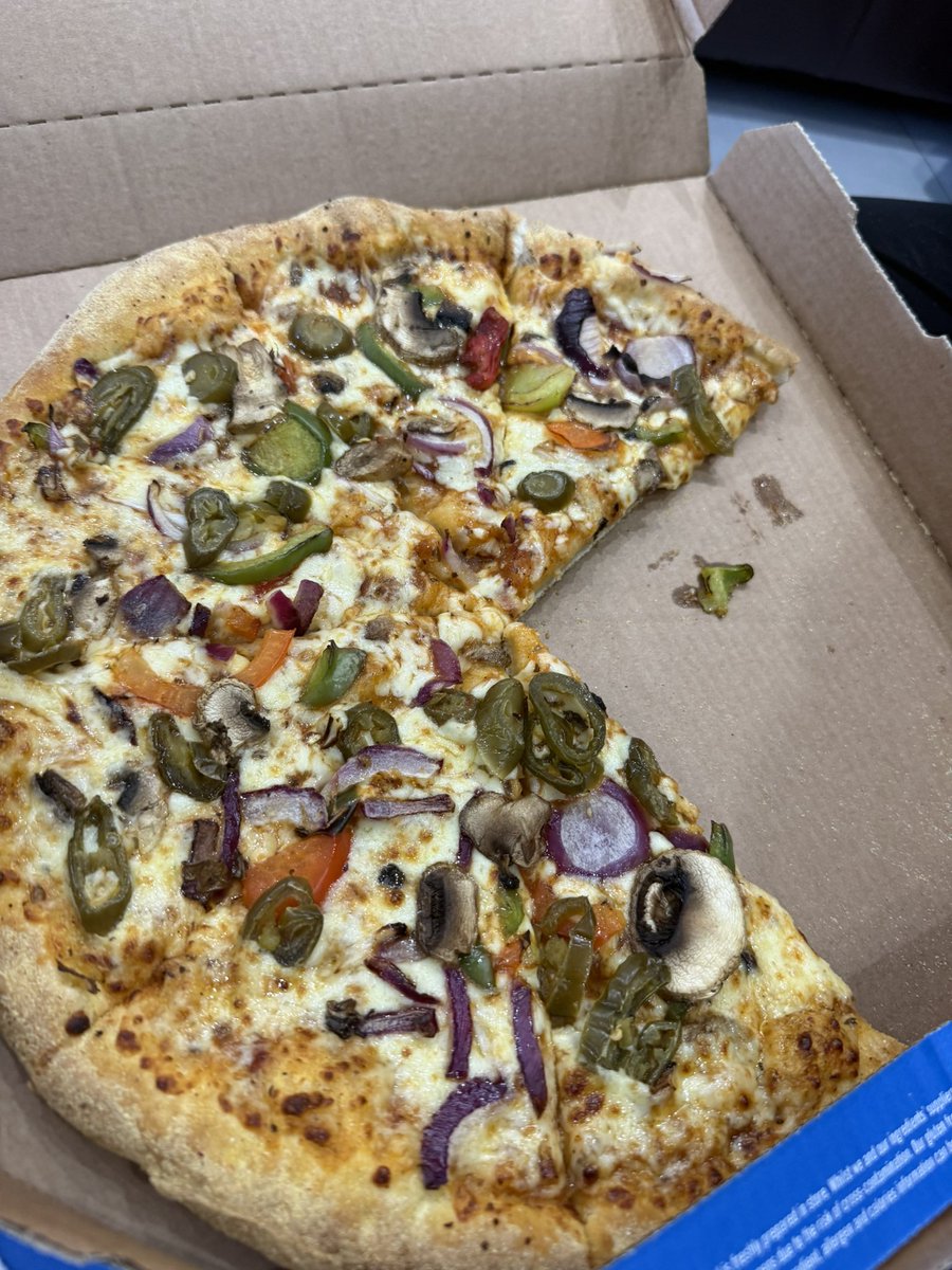 AmzK84's tweet photo. @Dominos_UK ordered veg pizza’s and received a random chicken piece (red) on a slice. Rude!! Do I get a refund? https://t.co/6ktcR4LMCr