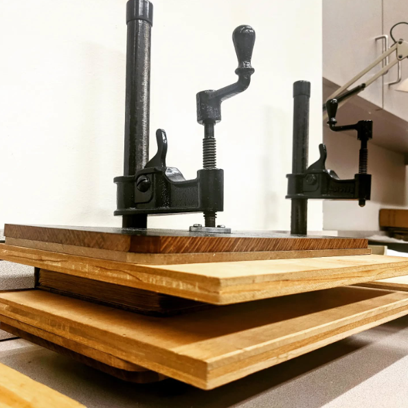 FordhamLibrary's tweet photo. Happy #PreservationWeek! To celebrate, we took a trip to the Archives &amp; Special Collections. Pictured here is a book press which helps repair damaged books and ensures the book is secure before going back down to the stacks 📖. 

Can you spot where the book is in this picture?🕵🏽 https://t.co/NK02w7AOee