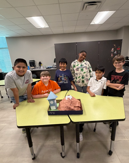 Our students had so much fun making volcanoes in science class! They mixed ingredients and watched their volcanoes erupt.