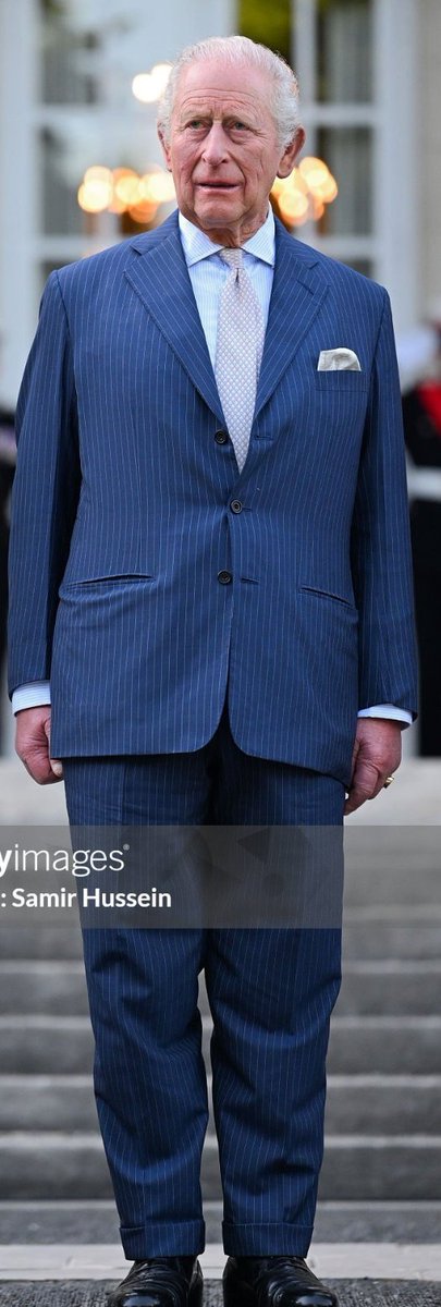 Now the King. He constantly rewears this petrol-coloured, pinstriped ...