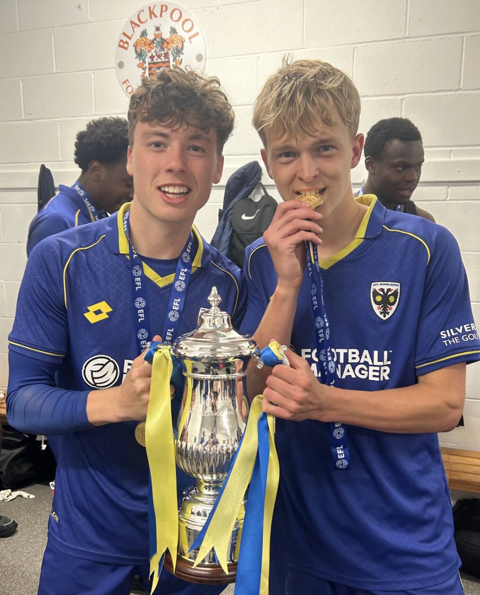 Dons_Sayer_WDON's tweet photo. 🏆 At the double! @HarryHedges34 and Finlay Fraser-Smith with the Youth Alliance Cup, added to the South title, but they and their teammates could be on for an incredible quadruple! Pro Dev League Cup to come and last season there was a North v South champions play-off! #AFCW 🏆 https://t.co/QkKeOvdnBt