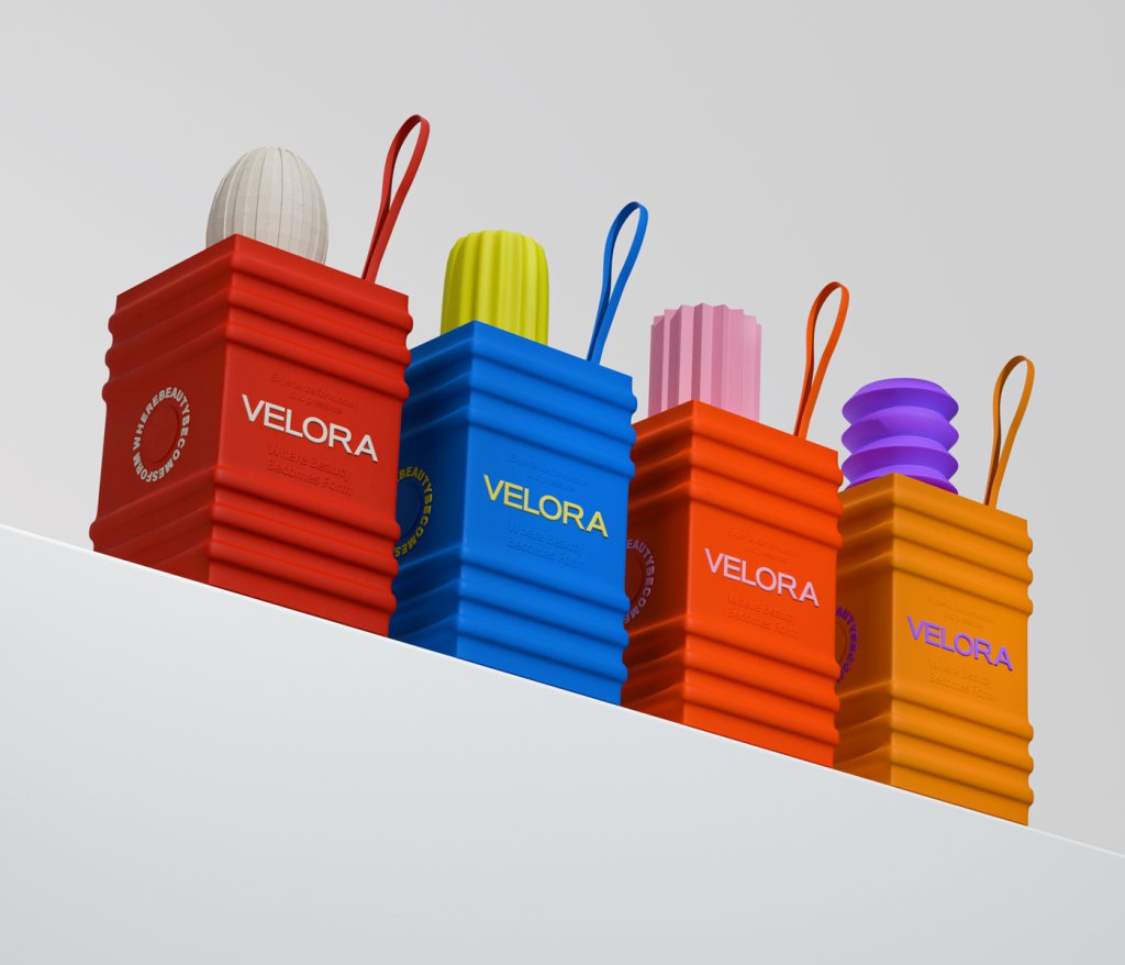 packagings's tweet image. "This is not a product. This is a form you carry." The text on the box says it all. Velora rejects conventional #beautypackaging language entirely, trading softness and minimalism for bold sculptural form, rhythmic surface texture, and high-contrast saturated colour. 
by Dorgam