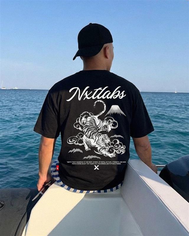 Nxtbrands's tweet photo. Day or night, still hits.

The Great Tiger Tee—glow-in-the-dark back print. https://t.co/nBY2vWJAko