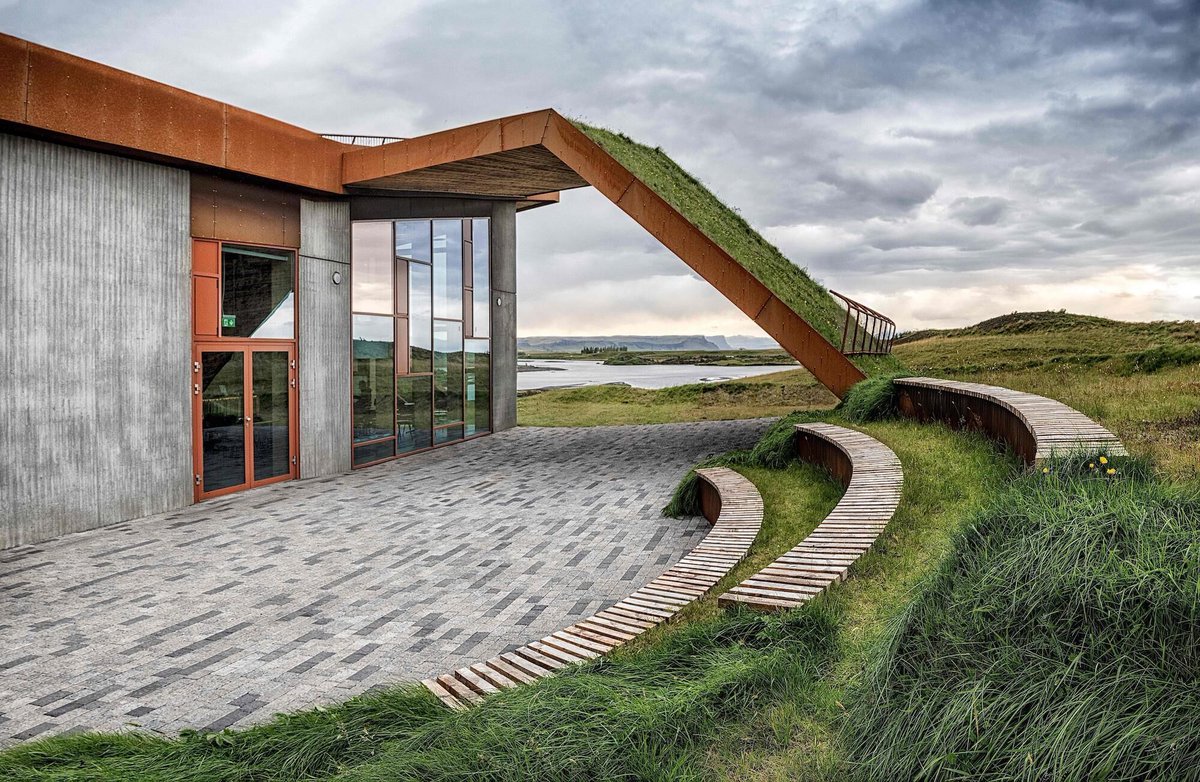 Archello's tweet image. The Vatnajökull National Park Visitor Centre by ARKÍS architects uses precast concrete, local timber, corten steel, and a turf roof to extend the landscape across the building. 
archello.com/project/vatnaj… 

#LandscapeArchitecture #NaturalMaterials #SustainableConstruction