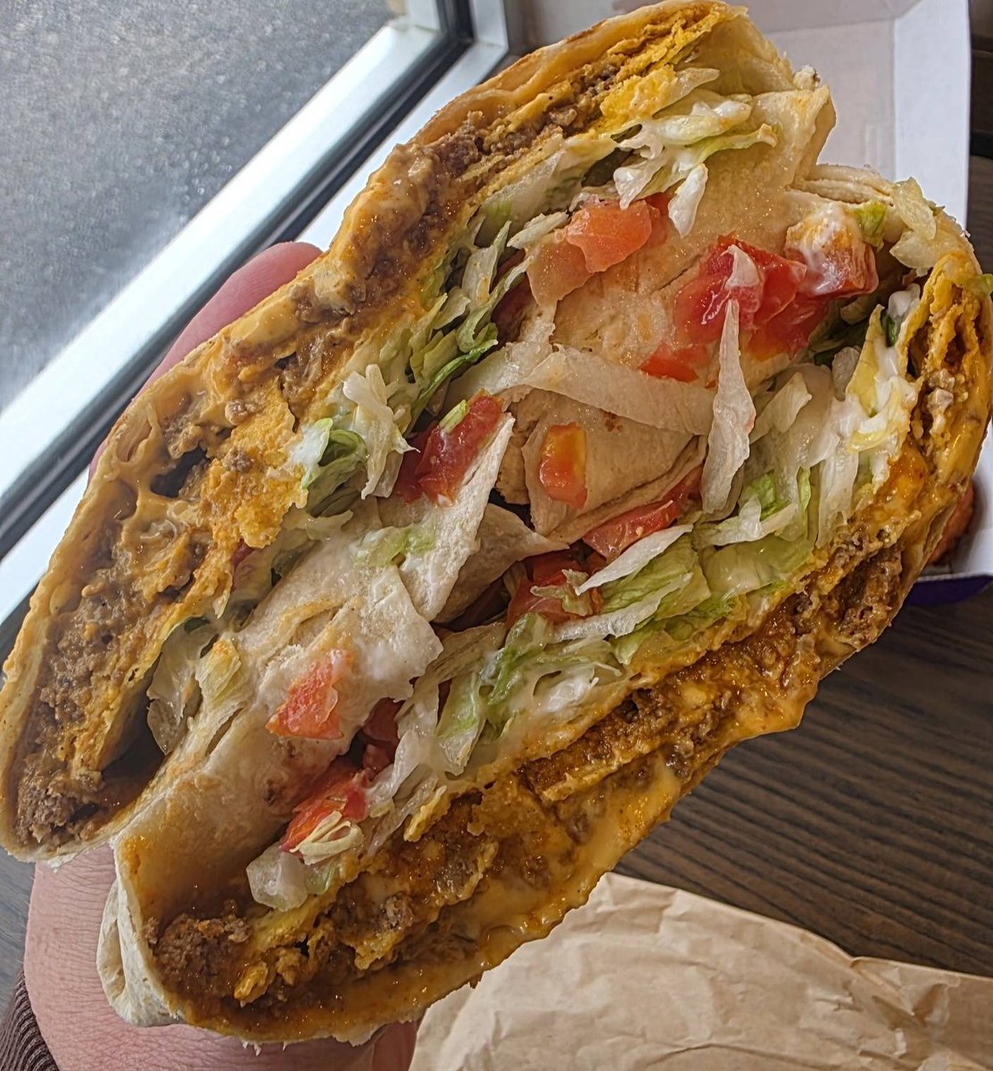 snackolator's tweet photo. The New Taco Bell Menu is here and those Diablo Coated Nuggets are absolutely 🔥🔥🔥

The Zab's Chicken Ranch Nacho Fries are great and the Triple Double Crunchwrap is so filling, but those nuggets deliver on spice in such a great way.

Are you trying any of the new Taco Bell items?!