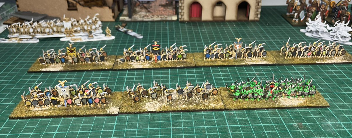 PhilDMackie's tweet photo. Today’s endeavors- more skeletons and the first stand of orcs. Why orcs are supposed to be green I have no idea but I decided to conform on this occasion. #10mm #fantasy #wargaming https://t.co/fxEhv9QdXy