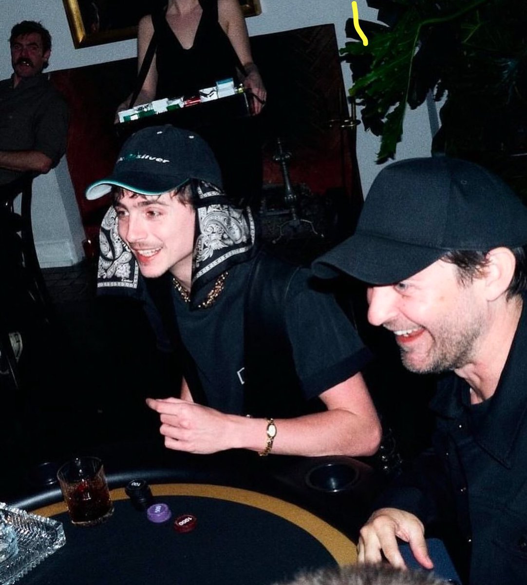 Tobey Maguire and Timothée Chalamet playing poker
