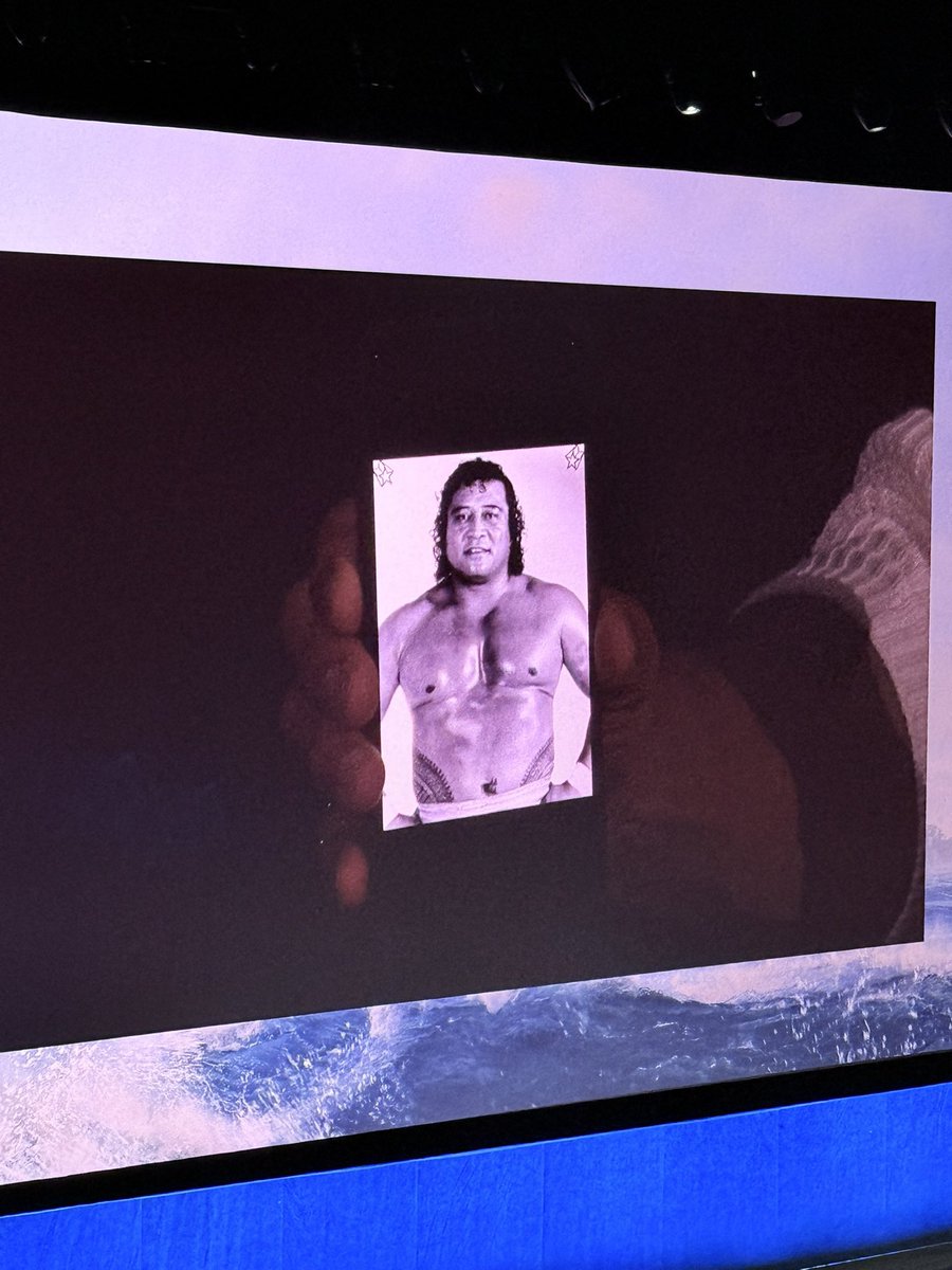 subnitmohanty's tweet image. The Rock shows a photo of his late grandfather who Maui is based on #Moana movies, at #CinemaCon 

“When you see me embodying Maui in this live-action version, every word &amp;amp; lyric that’s my grandfather”