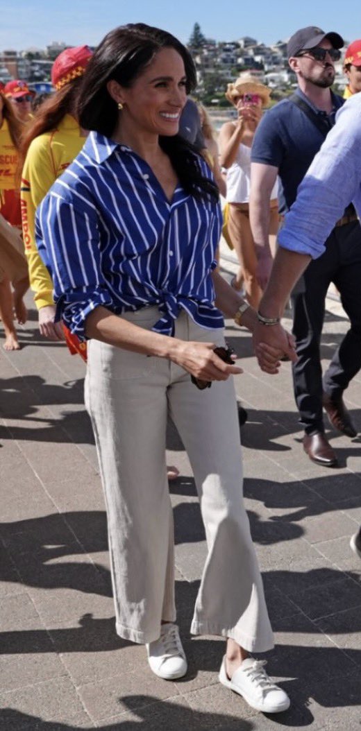 unreMARKLEble's tweet image. #HarryandMeghan made it to Bondi Beach where she went from hems pooling around her feet to high waters. The white pants are waaaay too tight, and I feel like we’ve seen the blue striped shirt with white pants look before. This whole thing is just embarrassing. They might make a