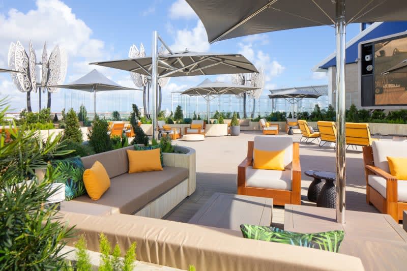 🌿✨ Welcome to the Rooftop Garden aboard the Celebrity Ascent! This luxurious outdoor space is perfect for enjoying stunning architectural views, and catching a movie on the big screen. 

Contact me today to book your getaway and enjoy the beauty of the Rooftop Garden! 📞