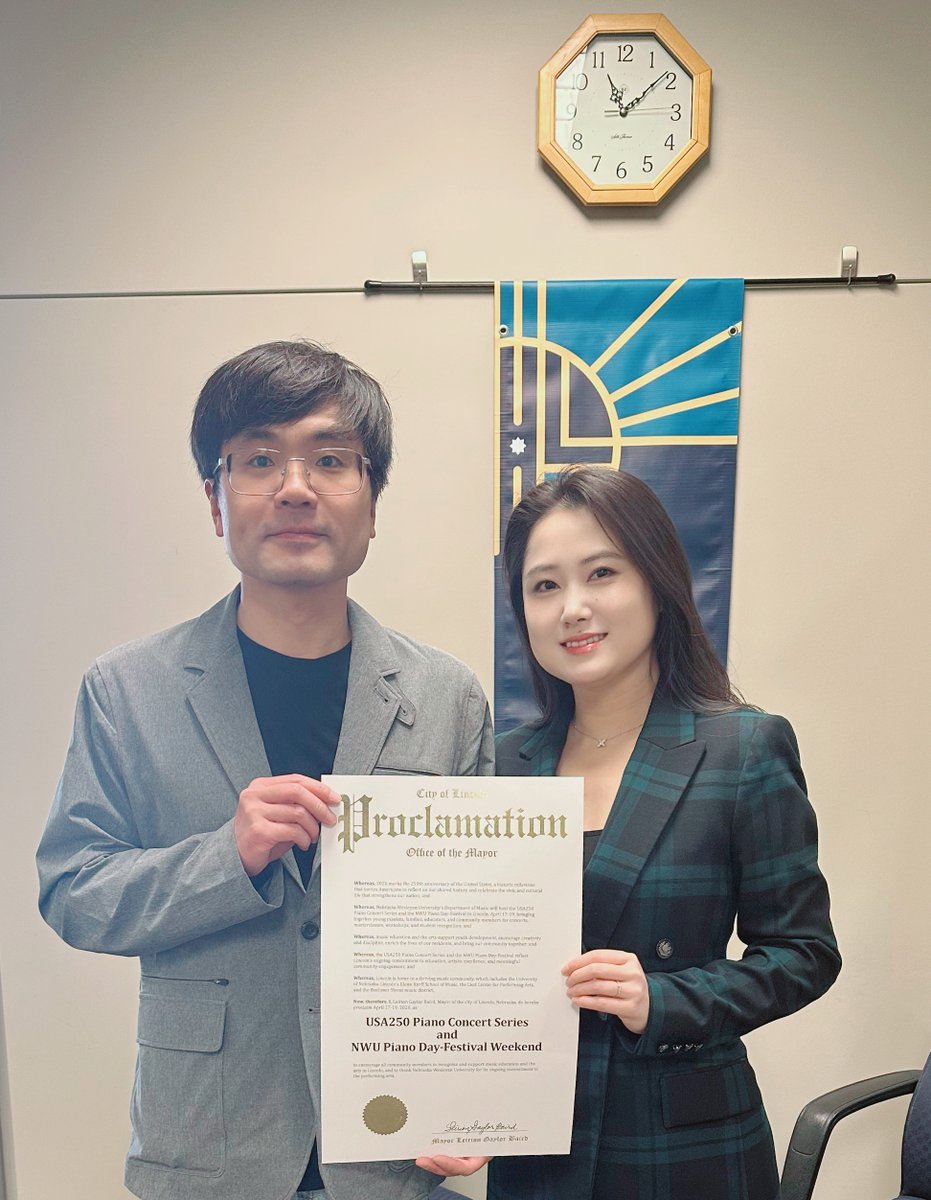 NEWesleyan's tweet photo. 📜✍🏼 From the desk of the mayor.

🎹 NWU piano faculty Drs. Feifei and Peter Jiang were awarded a mayoral proclamation from Lincoln mayor Leirion Gaylor Baird declaring this weekend as USA250 Piano Concert Series and NWU Piano Day-Festival Weekend.

🎹 You can help celebrate at 7 p.m. tonight at O'Donnell Auditorium as Feifei and Peter, also known as JF Piano Duo, perform a free concert. Reserve seats here: https://t.co/vU4kDcW1gY

🎹 At 7 p.m. Saturday, a concert featuring pianist Mackenzie Melemed will be held at O'Donnell Auditorium. Purchase tickets here: https://t.co/wICUO5F1bQ