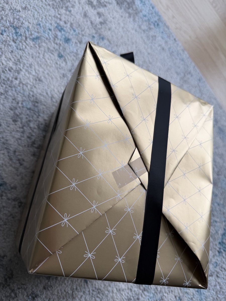 dealmaster's tweet photo. @Bloomingdales really this is how your non interested associates wrap a gift after paying for gift wrap?? https://t.co/LQ6OXoRFEk