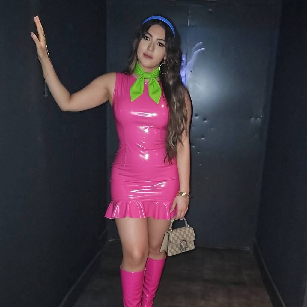 theconman1990's tweet image. Dressed as daphne. #pvc #latex #pink #purple #daphne