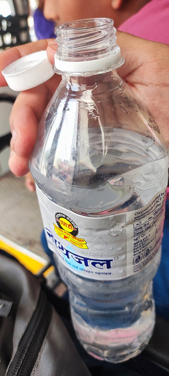 maybe_sadat's tweet photo. Serious complaint regarding food/water safety.I purchased a sealed 1L water bottle from an MSRTCauthorized vendor at Rajgurunagar bus stop while traveling Pune to Narayangaon on bus, Found fungal particles inside the sealed cap.I have photo micro-lens proof showing contamination. https://t.co/W4L1oocBgA