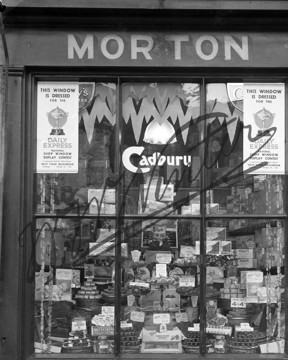 A wonderful display of sweets in the window of Morton's sweet shop.  This window display was for the Daily Express national shop window display contest of 1930. 
#Winters1852 #WWWinterHeritageTrust #WWWinterLtd #ShopFront