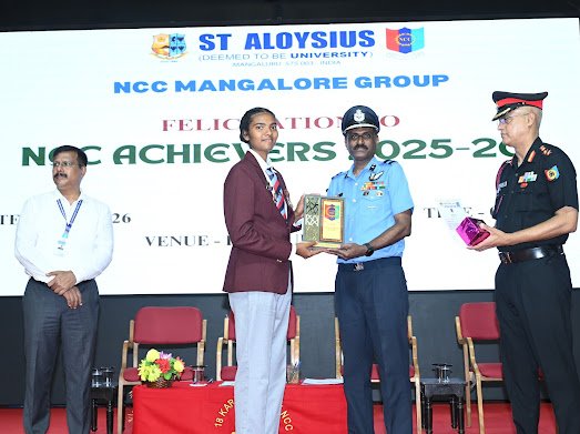 NCCPride_Mglr's tweet photo. DDG Karnataka &amp; Goa, Air Cmde SB Arunkumar, VSM, felicitated NCC cadets of Mangalore Group on 18 Apr 2026 at St Aloysius College, Mangalore. Cadets, officers, PI staff &amp; clerks were honored for their dedication and service. His words inspired all to strive for excellence. https://t.co/B6jTUkvrOx
