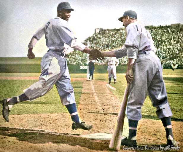BSmile's tweet photo. Today In 1946: Jackie Robinson is greeted with a handshake from teammate George Shuba after hitting a HR in his first game with the Montreal Royals - farm club of the Brooklyn Dodgers! The gesture is considered a historic interracial first for pro baseball. #Inspiration https://t.co/MnN17jOA8m