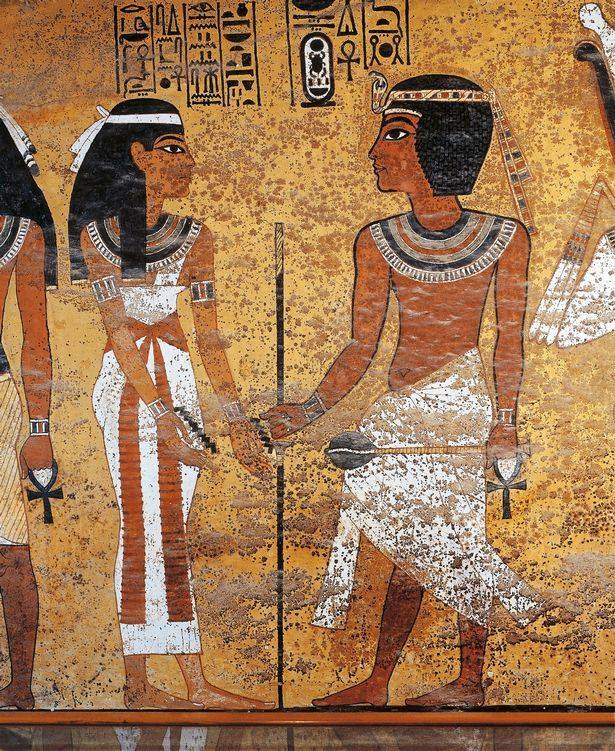 KV62:

“Nut, Mistress of the Sky, Lady of the Gods, who performs a welcome for Tutankhamun [each new King of Heaven] whom she gave birth…”
Her hands display the zigzag hieroglyph symbolising the “celestial waters” that appear at dusk &amp; disappear at dawn. The zigzags represent