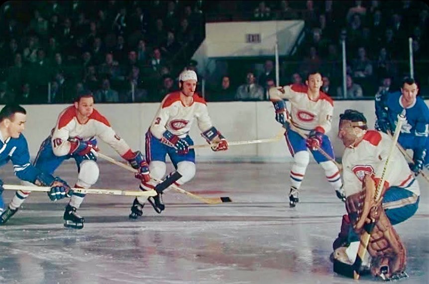A fabulous old time hockey pic of Habs great Tony Esposito (he played a couple of games for them in 1968-69)! The other Habs are Ted Harris, JC Tremblay and Yvan Cournoyer, while the Leafs I think are Bob Pulford on the left and Murray Oliver on the right.