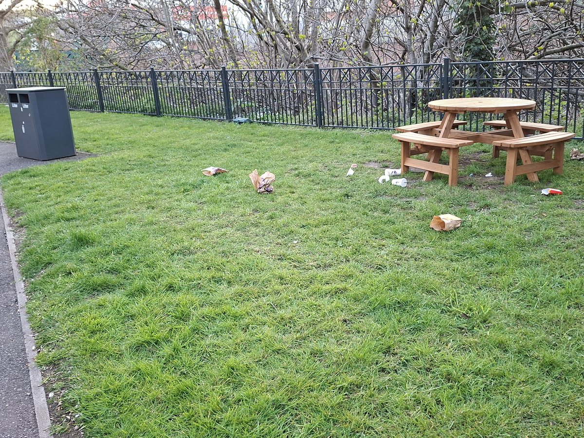 A sight that is seen more often nowadays. Such lazy scroats that they can't manage to throw their rubbish in the bins provided. How close do they want them to be!!