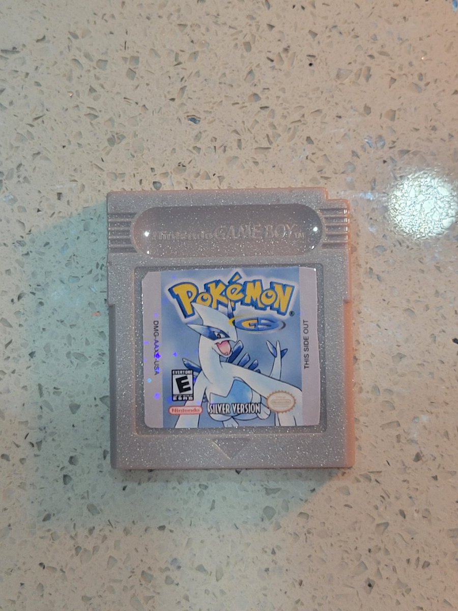 CorrealeCodes's tweet image. Picked up this copy of Pokemon Silver today! I deep cleaned it and remade the label as you can see from my rough hand cutting 🤣 I didnt have metallic paper so I went with a glossy paper and holo star laminate. May redo it with metallic later #pokemon #gameboy #retro #restoration