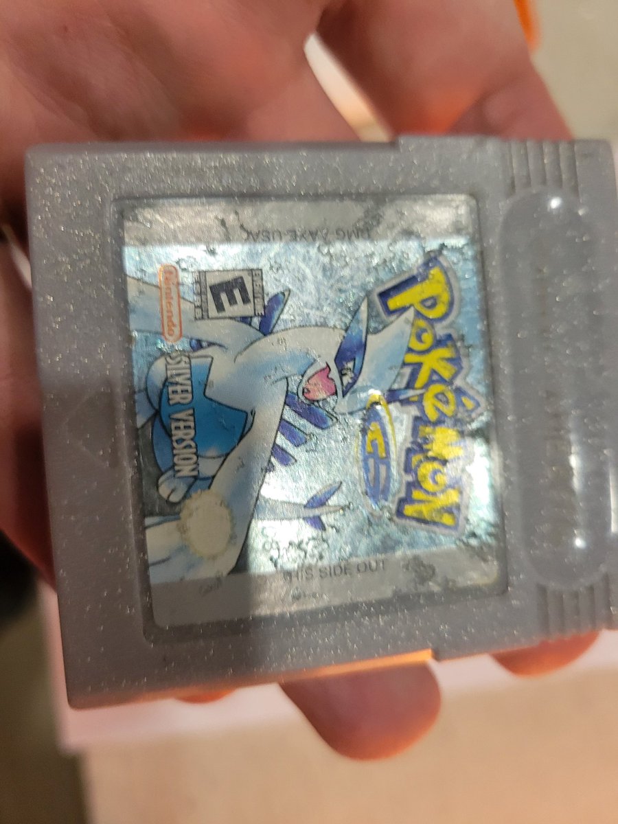 CorrealeCodes's tweet image. Picked up this copy of Pokemon Silver today! I deep cleaned it and remade the label as you can see from my rough hand cutting 🤣 I didnt have metallic paper so I went with a glossy paper and holo star laminate. May redo it with metallic later #pokemon #gameboy #retro #restoration