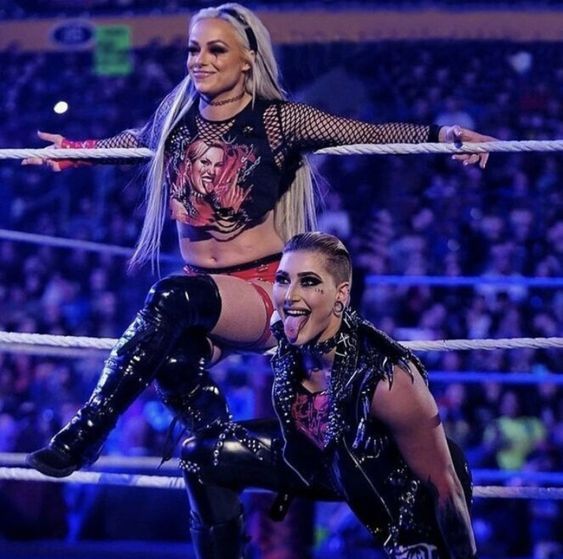 WatchMe__Liv's tweet photo. @RheaRipley_WWE @DomMysterio35 Watching Rhea put aside her rivalry with Liv to defend her from the haters is so unreal, but we can see the support they have for each other, leaving their differences in the ring behind. Anyway, Liv is the new Women's World Champion, as she's always been. 🔥 https://t.co/HpGJQU0vmt
