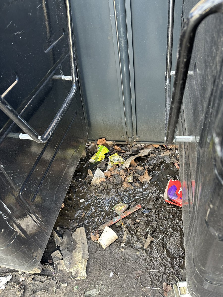 Colin_Fergus's tweet photo. Hi @MyGlasgowCC this is binhub NH02-192 outside 87 Berkeley St G3. The area under the bins hasn’t been swept out since installation last year. Gulley now blocked with rubbish and leaves, and is silting up with mud. Stagnant puddles either side. Can it be cleaned? @AngusCMillar https://t.co/Bk0A0UGcqO