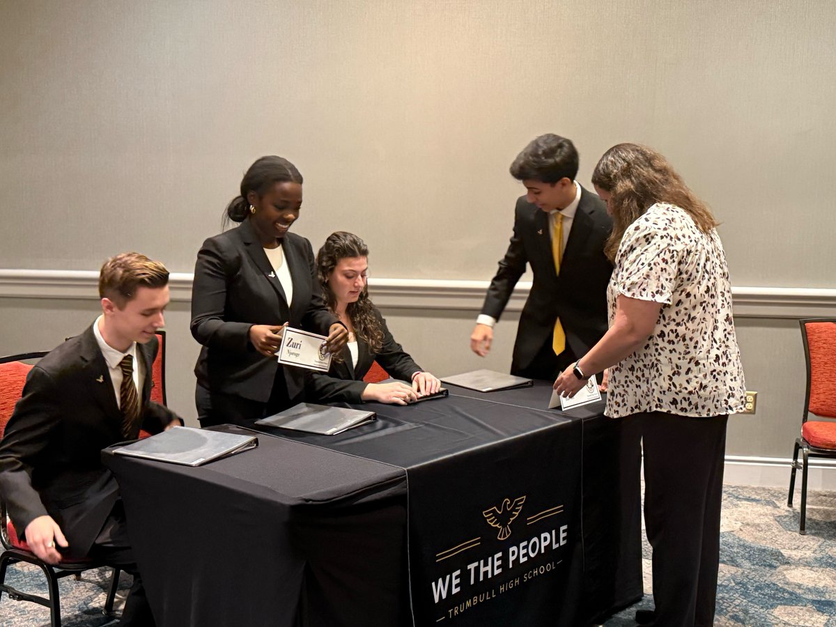 CivicEducation's tweet photo. Before the Top 10 hearings, it’s all focus.

Connecticut’s Trumbull HS team and their teacher Katie Boland preparing this morning—sharpening arguments and getting ready for the final round.

The Practice of Democracy, up close.

#WTPFinals #America250 https://t.co/hg7AGJXAwA