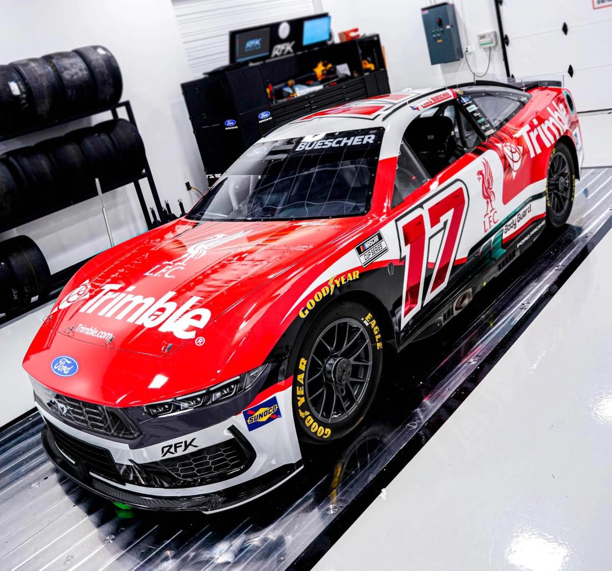 LFCTransferRoom's tweet photo. From Anfield to the asphalt 🏁🔴

The No.17 Trimble Ford Mustang Dark Horse of Chris Buescher looking absolutely class with Liverpool FC colors and logo. 

The car will debut in June at Sonoma Raceway. https://t.co/LKWmCggWQR