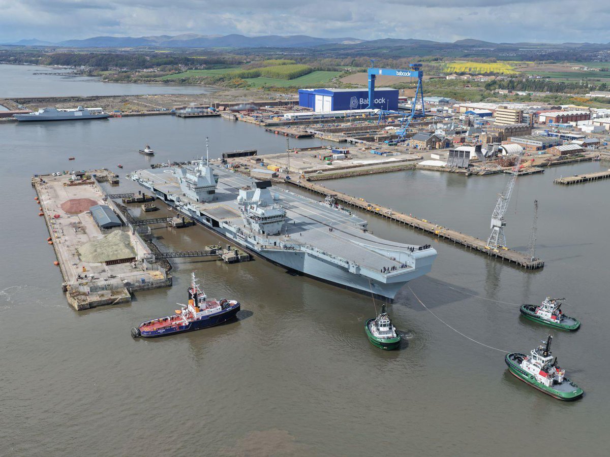 Babcockplc's tweet photo. An awe‑inspiring sight at Rosyth – engineering excellence supporting a vital national asset.

HMS Queen Elizabeth (@HMSQNLZ) departs, with sea trials next.

A proud milestone delivered by our team. https://t.co/jaX8iUKcCG